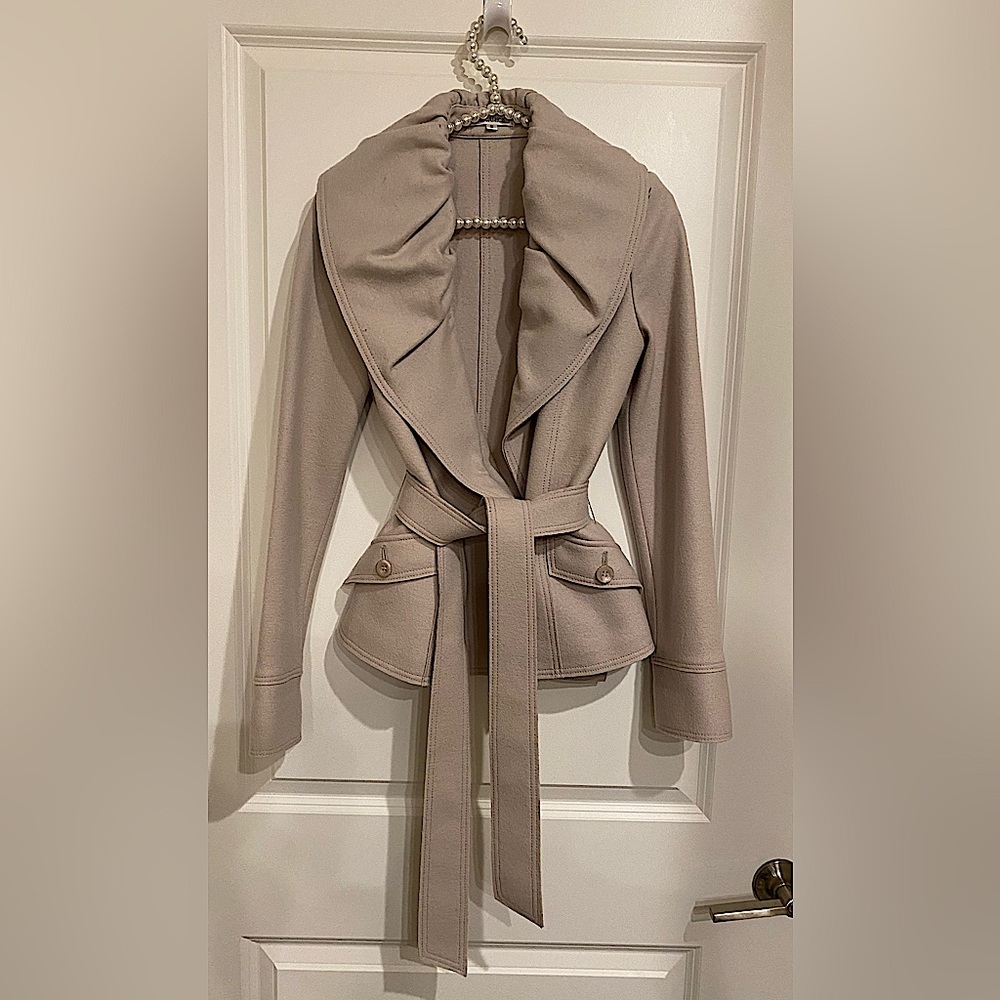 This is a beautiful little jacket that very versatile and chic! Wool and angora